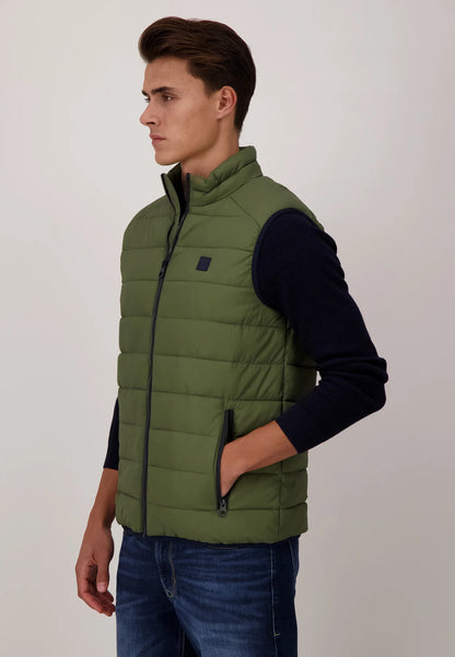 A Model Wearing Fynch-Hatton Quilted Top Padded Gilet Olive Green Side view with Hand in his Pocket 
