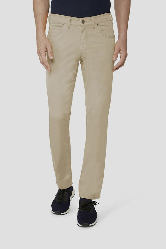 a model wearing Gardeur Cotton Flex Trousers Beige Beige with a black shirt and black shoes front view